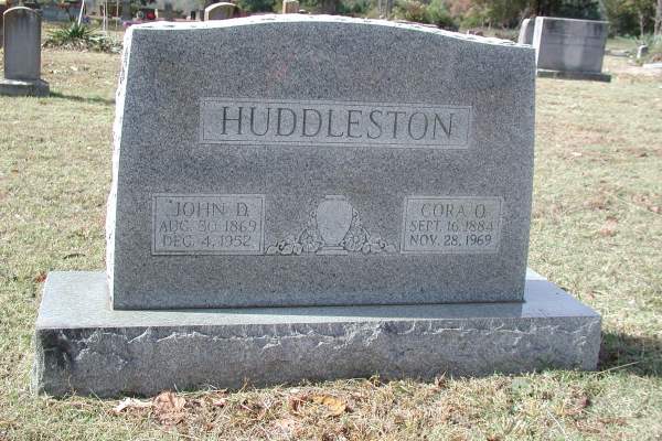 gravestone of John D. and Cora O Huddleston